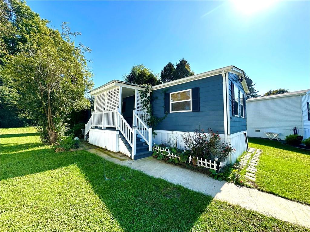 621 Sheafe Road Poughkeepsie, NY 12601 - Photo 1 of 1 Manufactured / mobile home featuring a front lawn