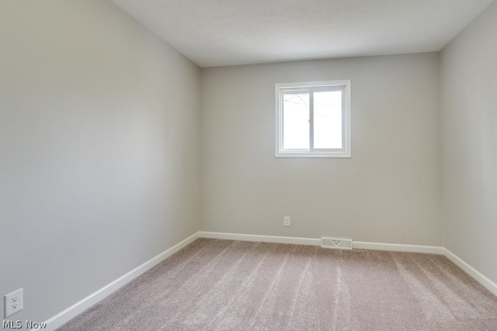 4596 Hattrick Road Rootstown, OH 44272 - Photo 25 of 45 Unfurnished room with light colored carpet