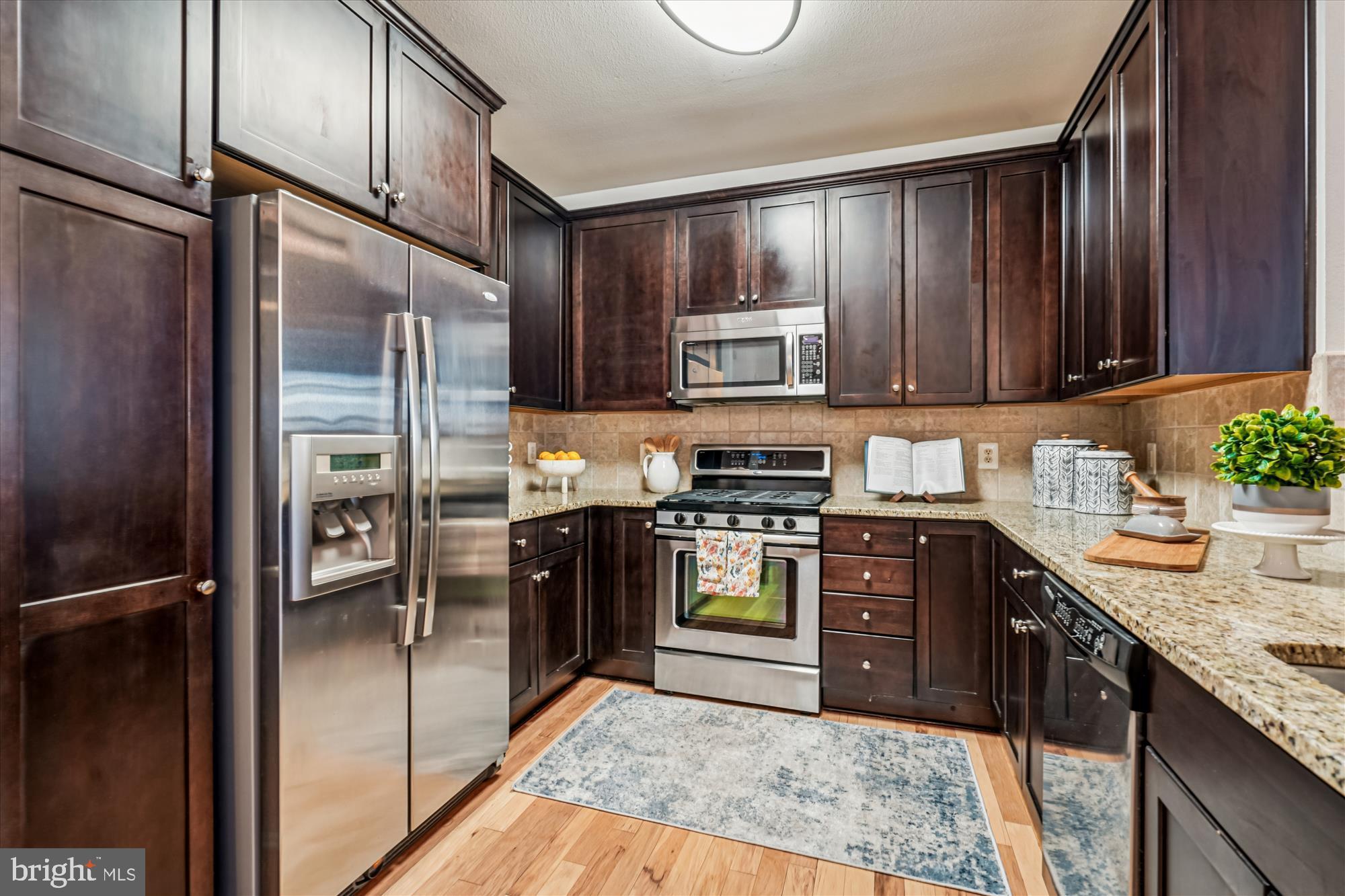 11750 Old Georgetown Road, Unit 2313 Rockville, MD 20852 - Photo 16 of 59 a kitchen with stainless steel appliances granite countertop a refrigerator stove and sink
