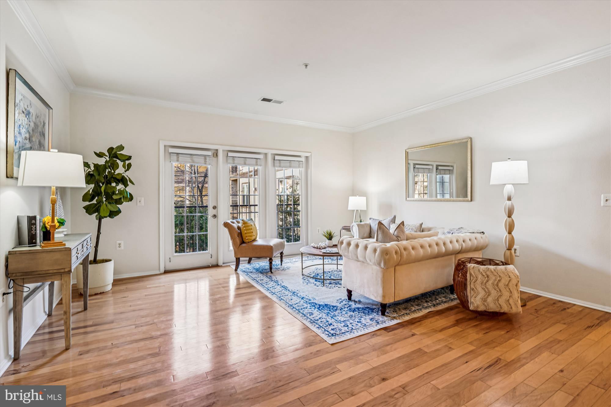 11750 Old Georgetown Road, Unit 2313 Rockville, MD 20852 - Photo 20 of 59 a living room with furniture and wooden floor