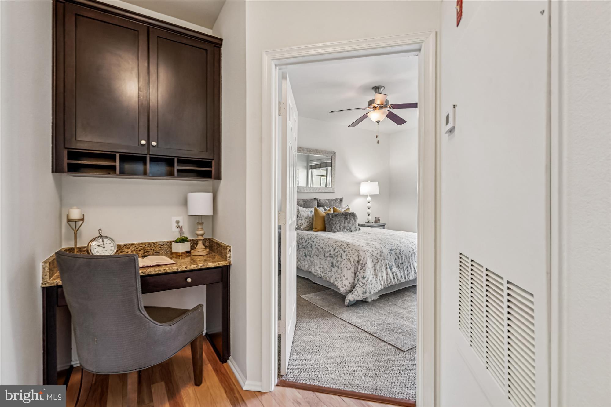 11750 Old Georgetown Road, Unit 2313 Rockville, MD 20852 - Photo 26 of 59 a living room with furniture and a lamp