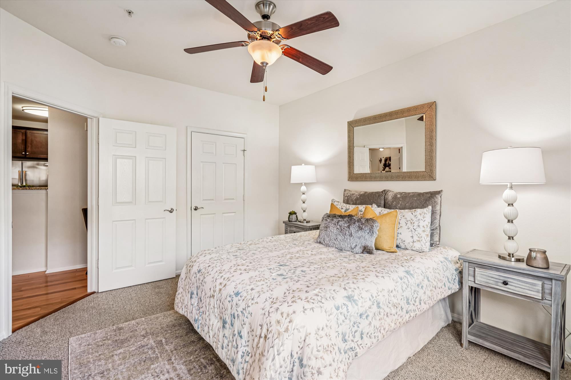 11750 Old Georgetown Road, Unit 2313 Rockville, MD 20852 - Photo 28 of 59 a bedroom with a bed and a chandelier