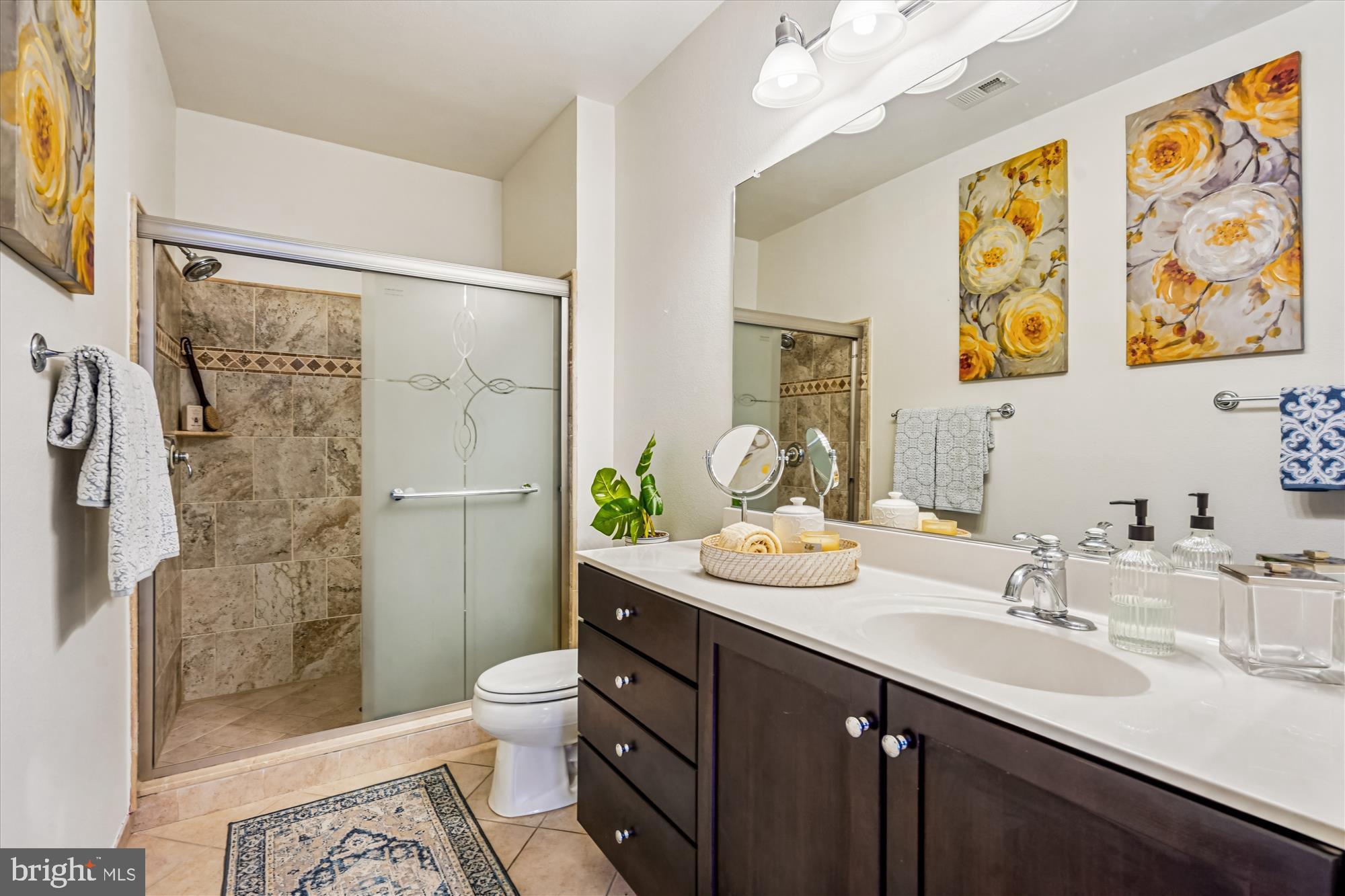 11750 Old Georgetown Road, Unit 2313 Rockville, MD 20852 - Photo 31 of 59 a bathroom with a double vanity sink toilet and shower