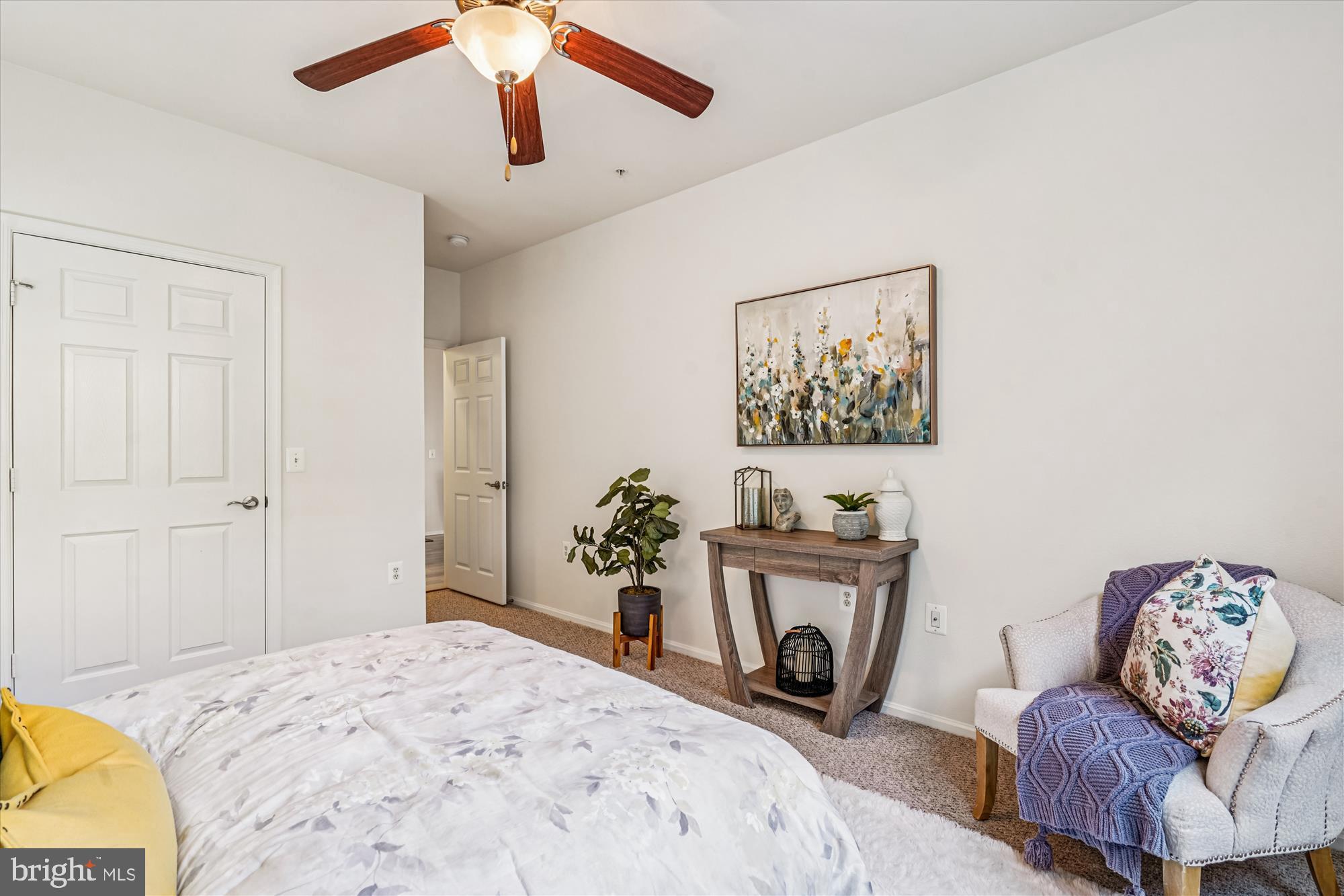 11750 Old Georgetown Road, Unit 2313 Rockville, MD 20852 - Photo 34 of 59 a bedroom with a bed a couch and a potted plant