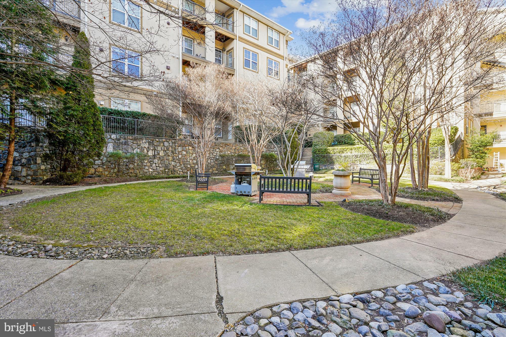 11750 Old Georgetown Road, Unit 2313 Rockville, MD 20852 - Photo 42 of 59 a backyard of a building with large trees