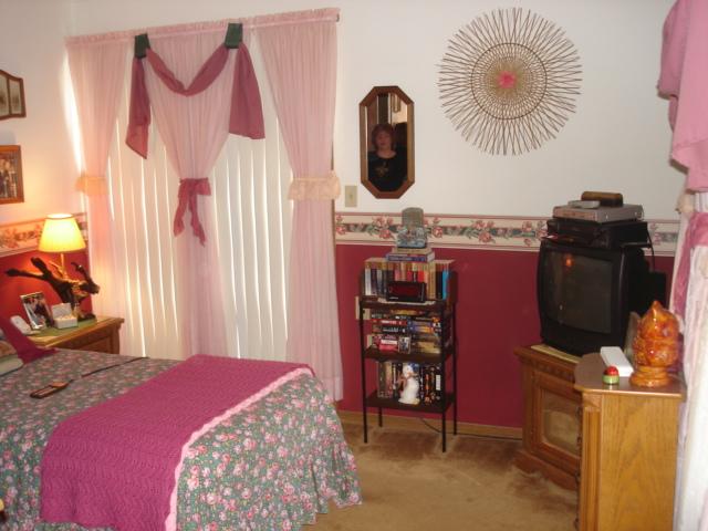 9-10 Hemlock Road Kunkletown, PA 18058 - Photo 11 of 12 a bedroom with a bed and a chandelier