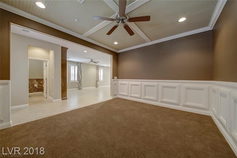 3144 Whitfeild Avenue Henderson, NV 89044 - Photo 6 of 55 A versatile interior space features wainscoting and a distinctive beadboard tray ceiling, ready for personalization.