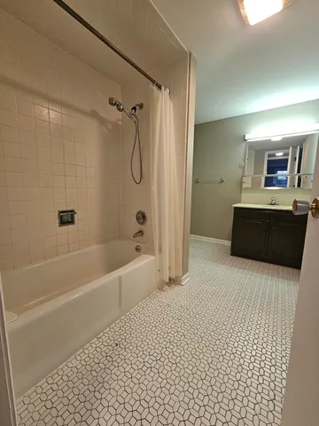 a spacious bathroom with a bathtub sink and a shower