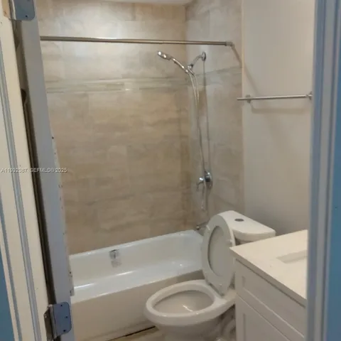 a bathroom with a sink a toilet and a bathtub