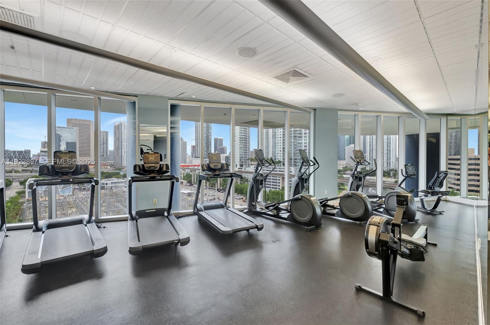 185 Southwest 7th Street, Unit 1612 Miami, FL 33130 - Photo 17 of 21 a view of a room with gym equipment