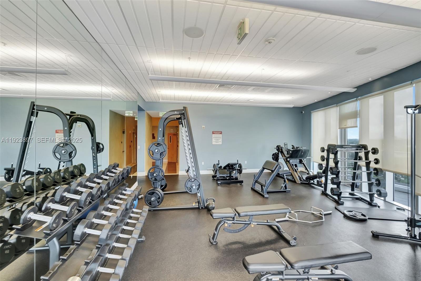 185 Southwest 7th Street, Unit 1612 Miami, FL 33130 - Photo 9 of 21 a view of a room with gym equipment