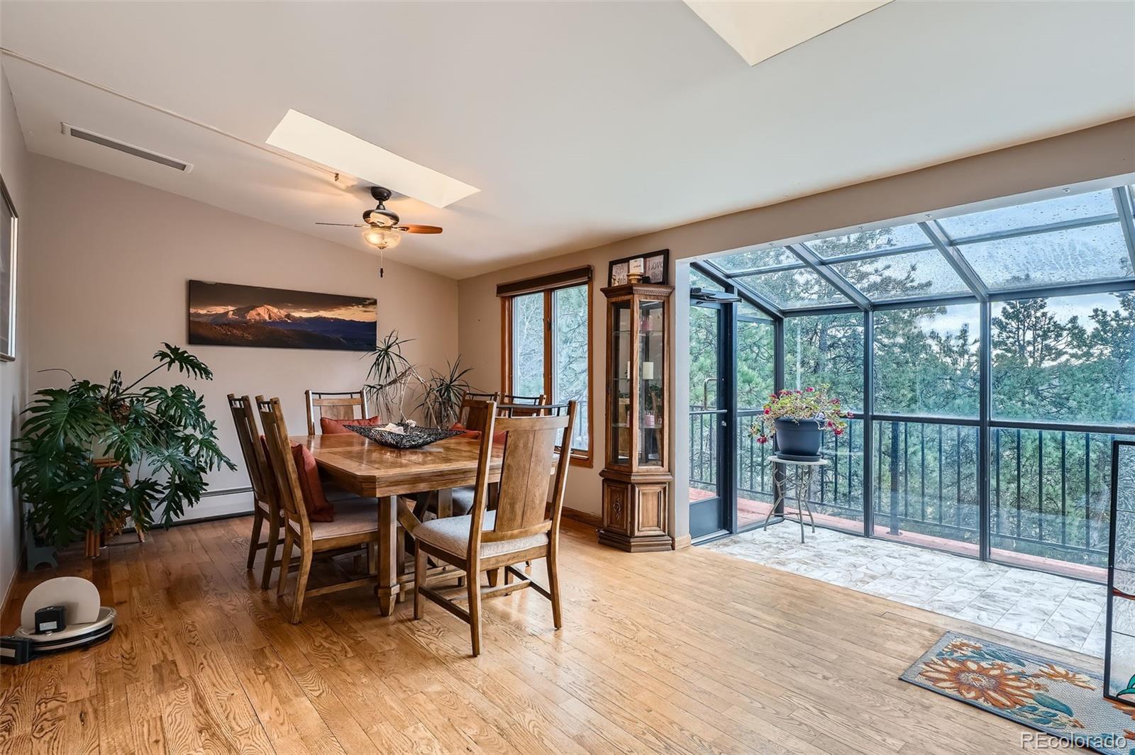21191 Pleasant Park Road Conifer, CO 80433 - Photo 16 of 44 a dining room with furniture and window