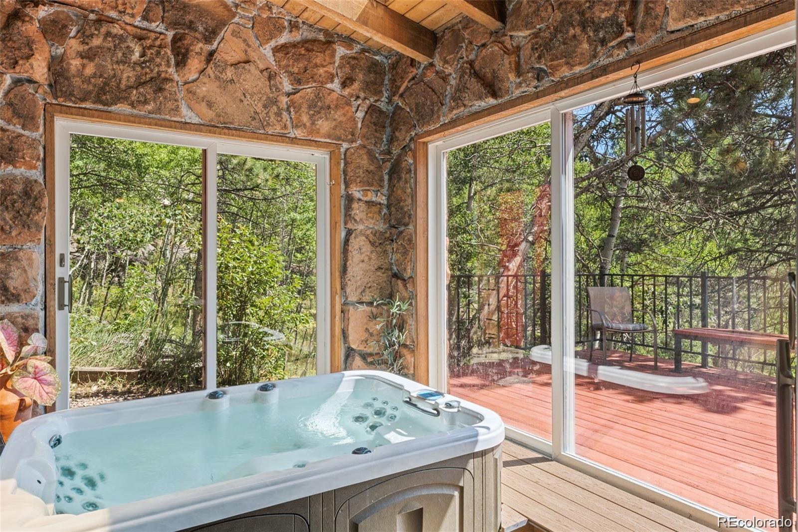 21191 Pleasant Park Road Conifer, CO 80433 - Photo 31 of 44 a bath tub sitting in front of a window