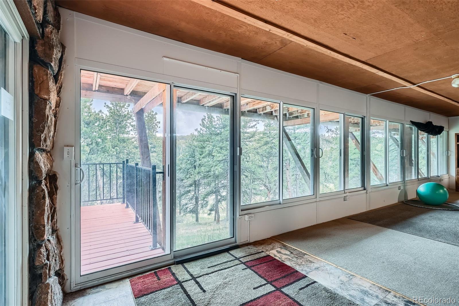 21191 Pleasant Park Road Conifer, CO 80433 - Photo 41 of 44 a view of a room that has a bed