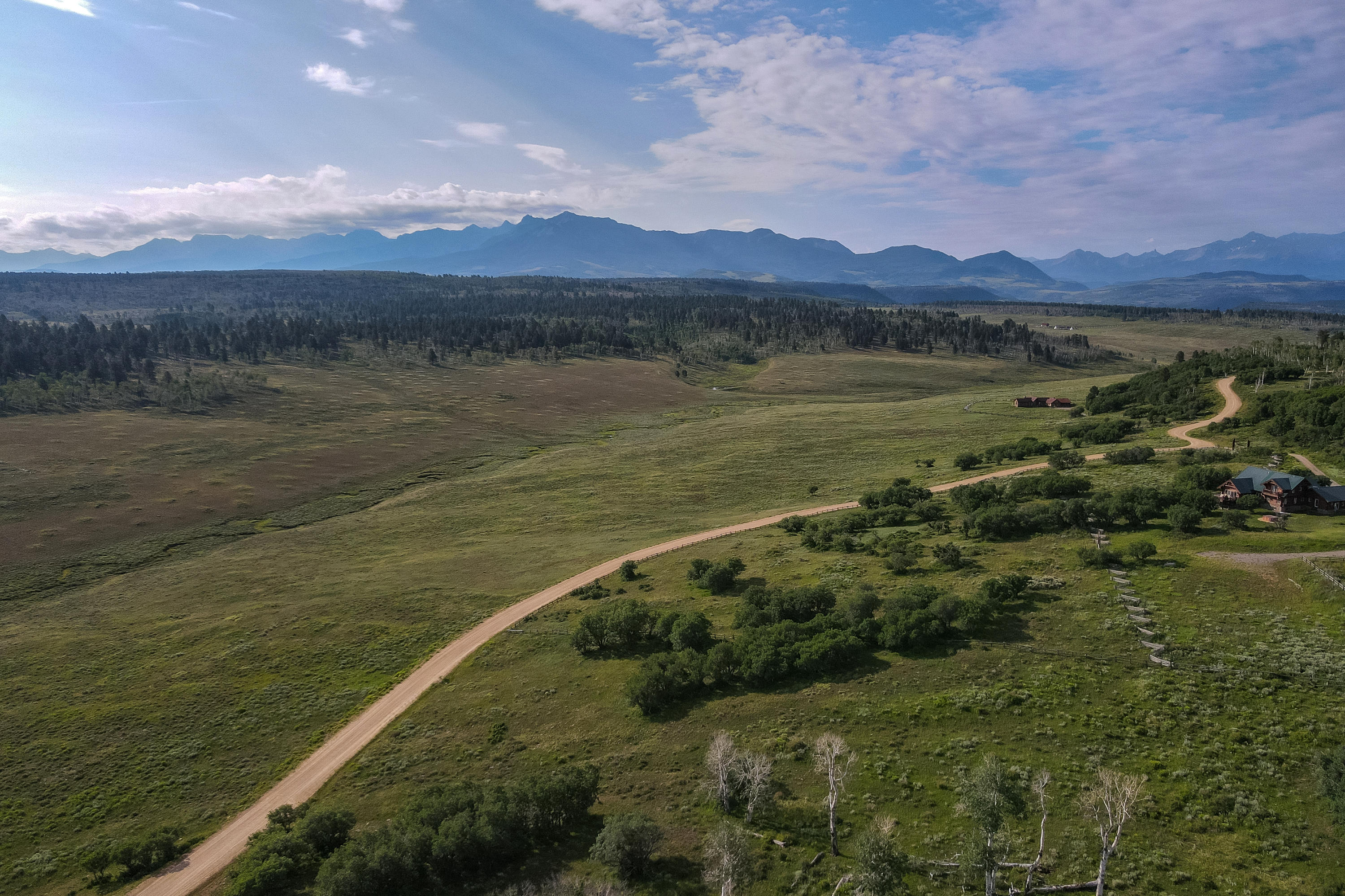 Tbd McKenzie Springs Road Placerville, CO 81430 - Photo 2 of 9 a view of a lake with a mountain