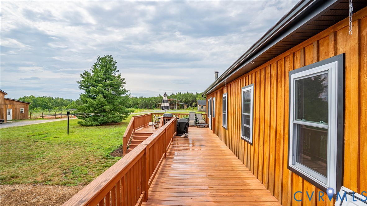 1451 Dixie Hill Road Dillwyn, VA 23936 - Photo 26 of 51 Expansive wooden deck with railing, featuring natu