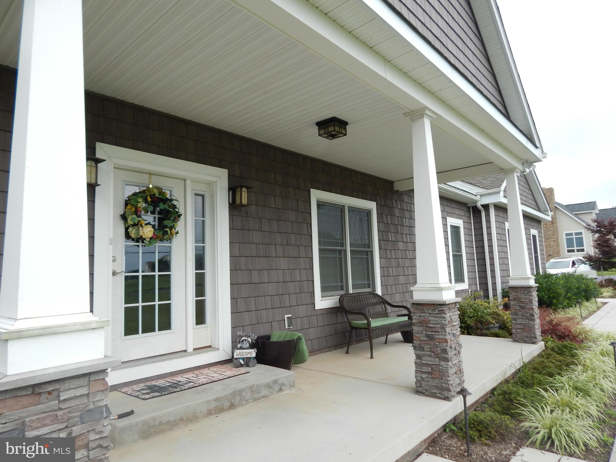 Covered Front Entrance with a Pastoral View