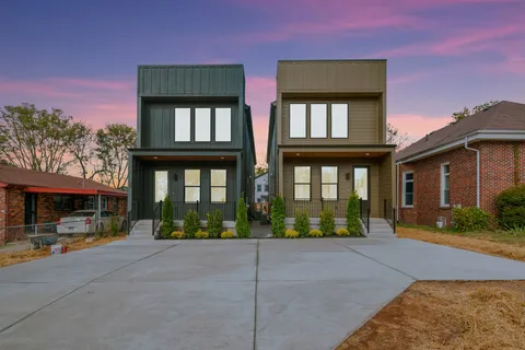 front view of brick house with a yard