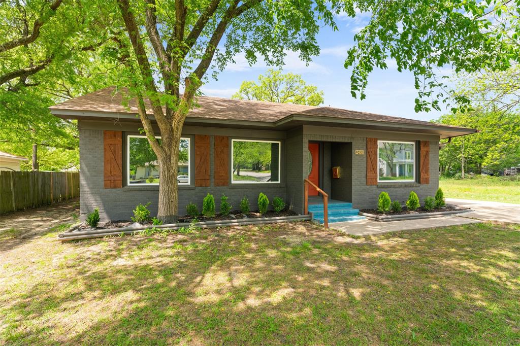 2405 Monroe Street Commerce, TX 75428 - Photo 4 of 31 a house view with a outdoor space