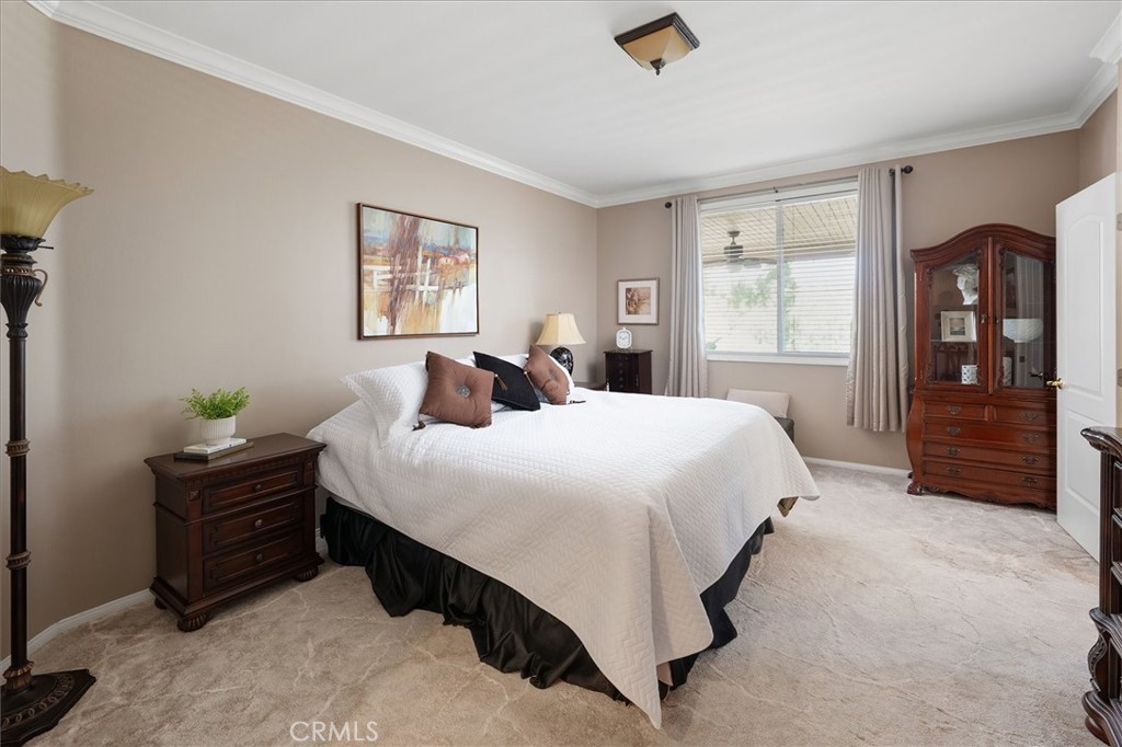 25808 Barnett Lane Stevenson Ranch, CA 91381 - Photo 15 of 38 a bedroom with a bed and a dresser