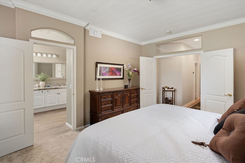 25808 Barnett Lane Stevenson Ranch, CA 91381 - Photo 18 of 38 a bedroom with a bed and a large mirror
