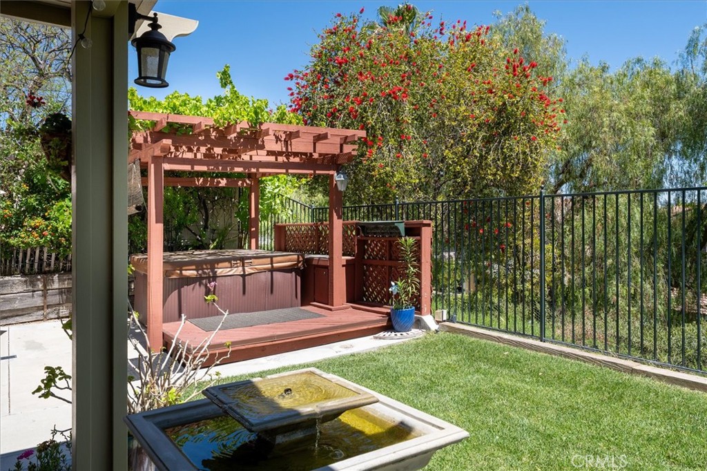25808 Barnett Lane Stevenson Ranch, CA 91381 - Photo 25 of 38 a view of a patio with a table chairs and a backyard