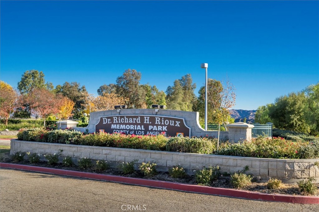 25808 Barnett Lane Stevenson Ranch, CA 91381 - Photo 33 of 38 a view of sign board with flower around