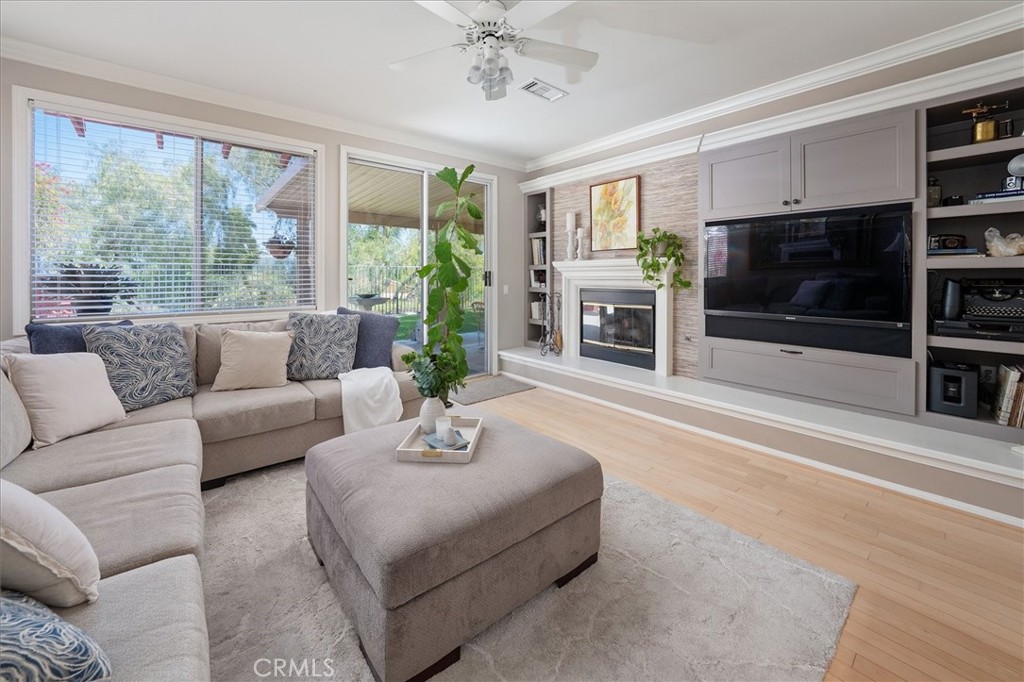25808 Barnett Lane Stevenson Ranch, CA 91381 - Photo 5 of 38 a living room with furniture a flat screen tv and a large window