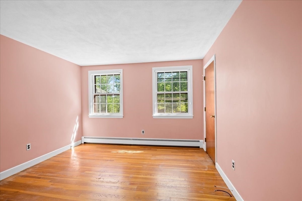 352 Hill Road Boxborough, MA 01719 - Photo 15 of 25 an empty room with wooden floor and windows