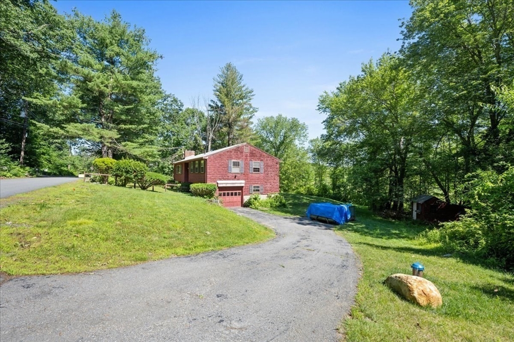352 Hill Road Boxborough, MA 01719 - Photo 24 of 25 a front view of a house with garden