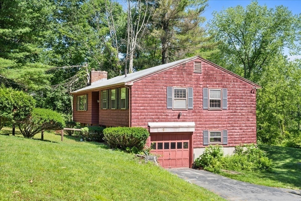 352 Hill Road Boxborough, MA 01719 - Photo 3 of 25 a view of a house with a yard and plants
