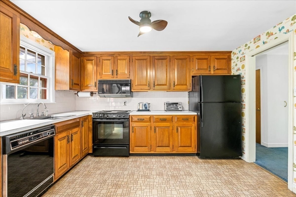 352 Hill Road Boxborough, MA 01719 - Photo 5 of 25 a kitchen with stainless steel appliances granite countertop a refrigerator stove and oven