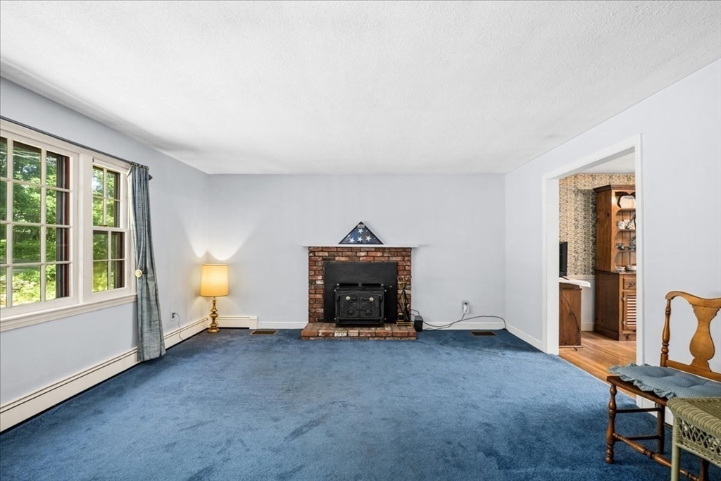 352 Hill Road Boxborough, MA 01719 - Photo 9 of 25 a living room with furniture and a fireplace