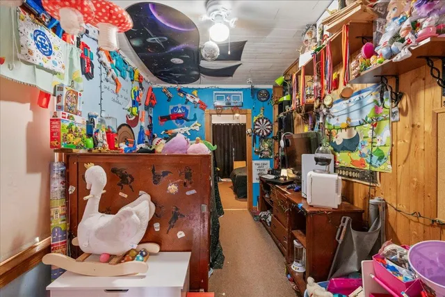 a bed room with a bed and a chair