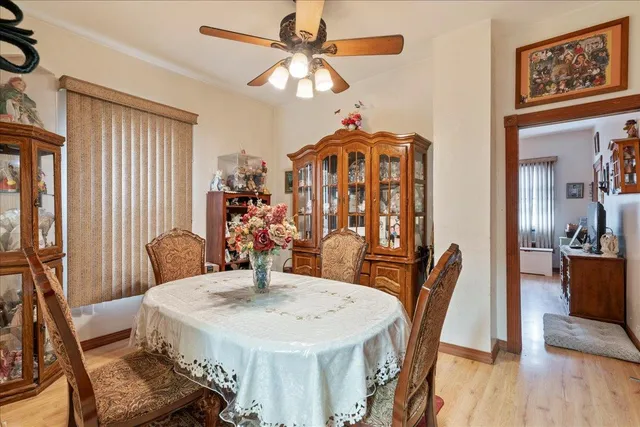 a dining room with furniture and wooden floor