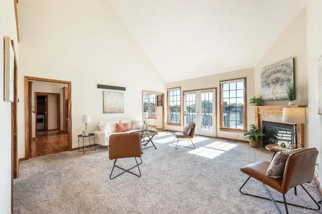 a spacious bathroom with a double vanity sink a mirror and a bathtub