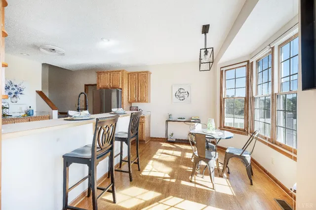a bathroom with a granite countertop sink mirror and shower