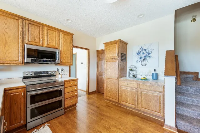 a white toilet sitting next to a small window