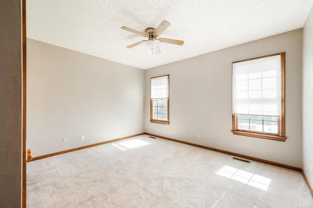 a view of workspace with furniture and a window