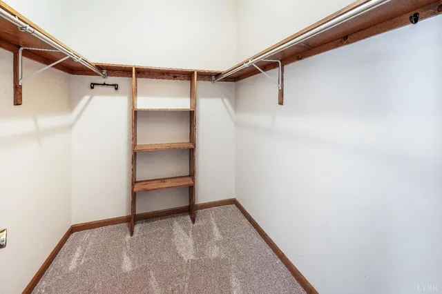 a view of a dining room with furniture and a window