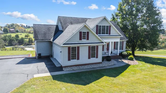 a view of a lake with a garden and trees