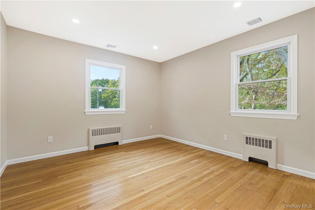 5 Paddock Road Rye Brook, NY 10573 - Photo 13 of 23 bedroom with a healthy amount of sunlight