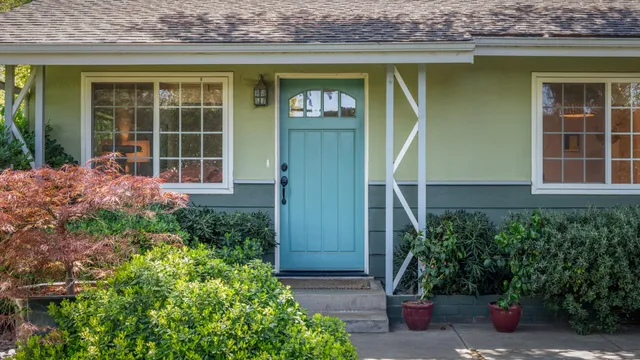 front view of a house with a potted plant