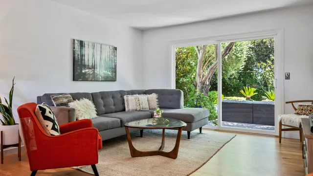 a living room with furniture and a large window