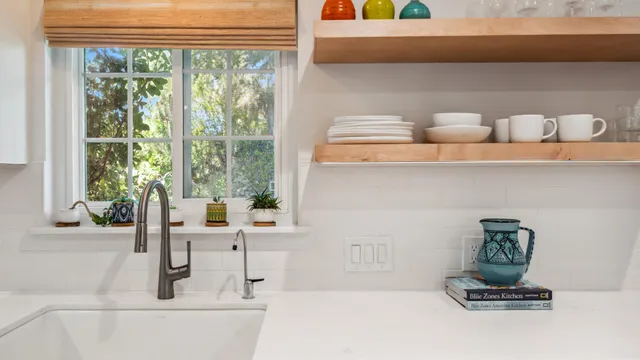 a kitchen with a sink and a window