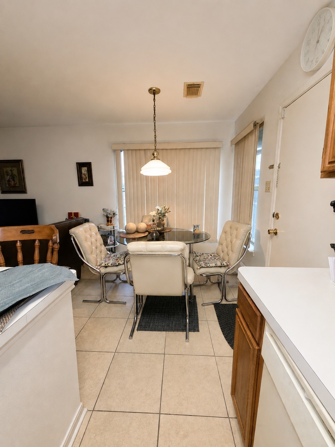 14102 Twisted Rattan Lane Houston, TX 77015 - Photo 12 of 28 Breakfast Area: Cozy dining space conveniently located just off the kitchen, featuring tile flooring, overhead lighting, and plenty of natural light from the surrounding windows.