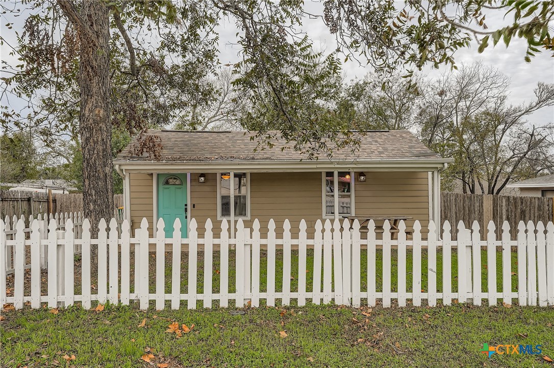 304 South Main Street Elgin, TX 78621 - Photo 1 of 25 Front of home complete with a white picket fence