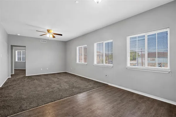 a view of an empty room with a window