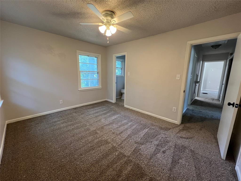 213 Wanda Way Hurst, TX 76053 - Photo 16 of 29 Primary bedroom also with carpet and a full bath
