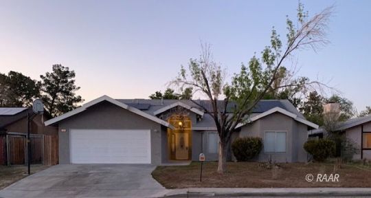 316 West Felspar Avenue Ridgecrest, CA 93555 - Photo 1 of 16 a front view of a house with garden